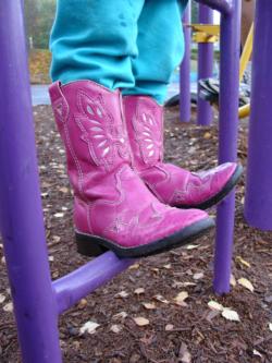 Girl with Boots on Jungle Gym